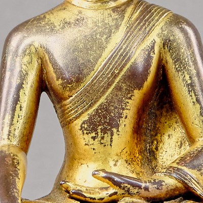 Lot 318 - A SEATED BRONZE GILT BUDDHA, TIBET, 15TH CENTURY