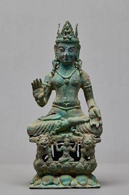 Lot 91 - SEATED BRONZE BODHISATTVA ON A LION THRONE, KASHMIR, 12TH CENTURY