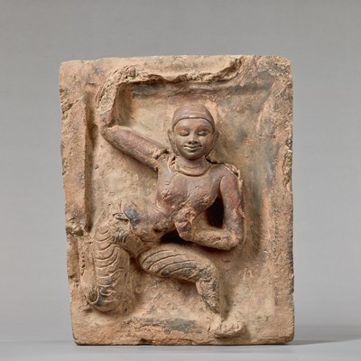 Lot 380 - PROBABLY A YAKSHI (NATURE SPIRIT) IN RELIEF EASTERN INDIA, 11TH–12TH CENTURY